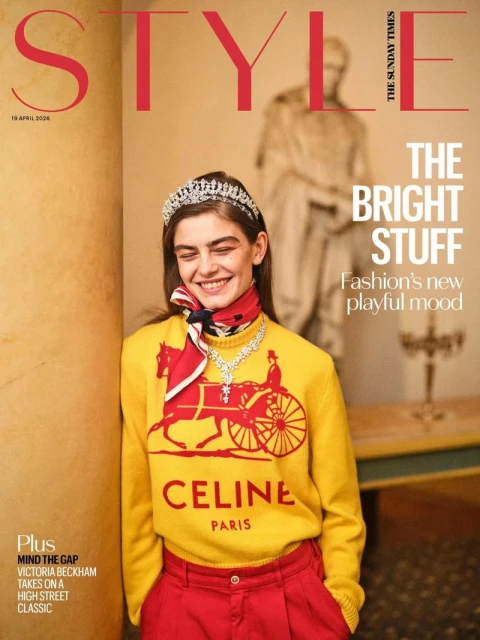 Merlijne Schorren wearing a yellow Celine graphic sweater, red trousers, and a tiara on The Sunday Times Style cover.