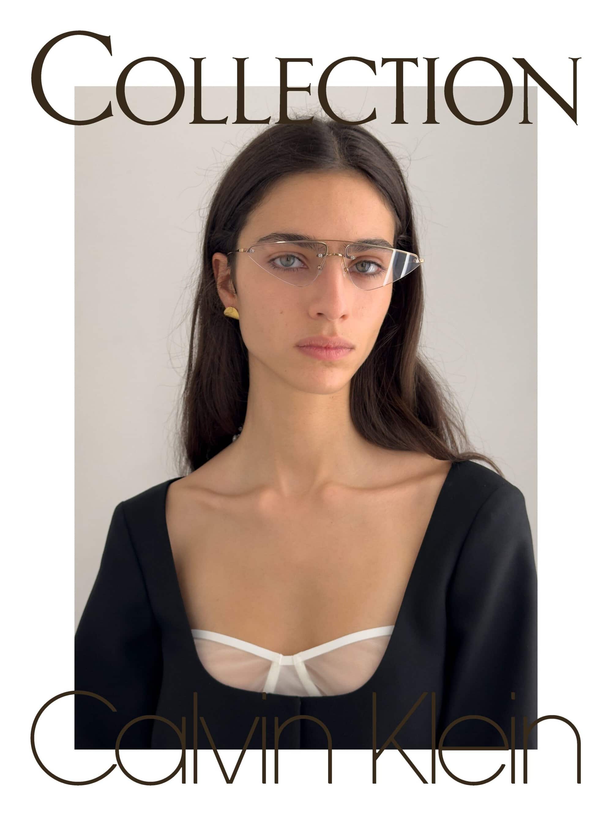 Model Loli Bahia wearing rimless geometric glasses and a black square-neck top in the Calvin Klein Spring 2026 campaign.