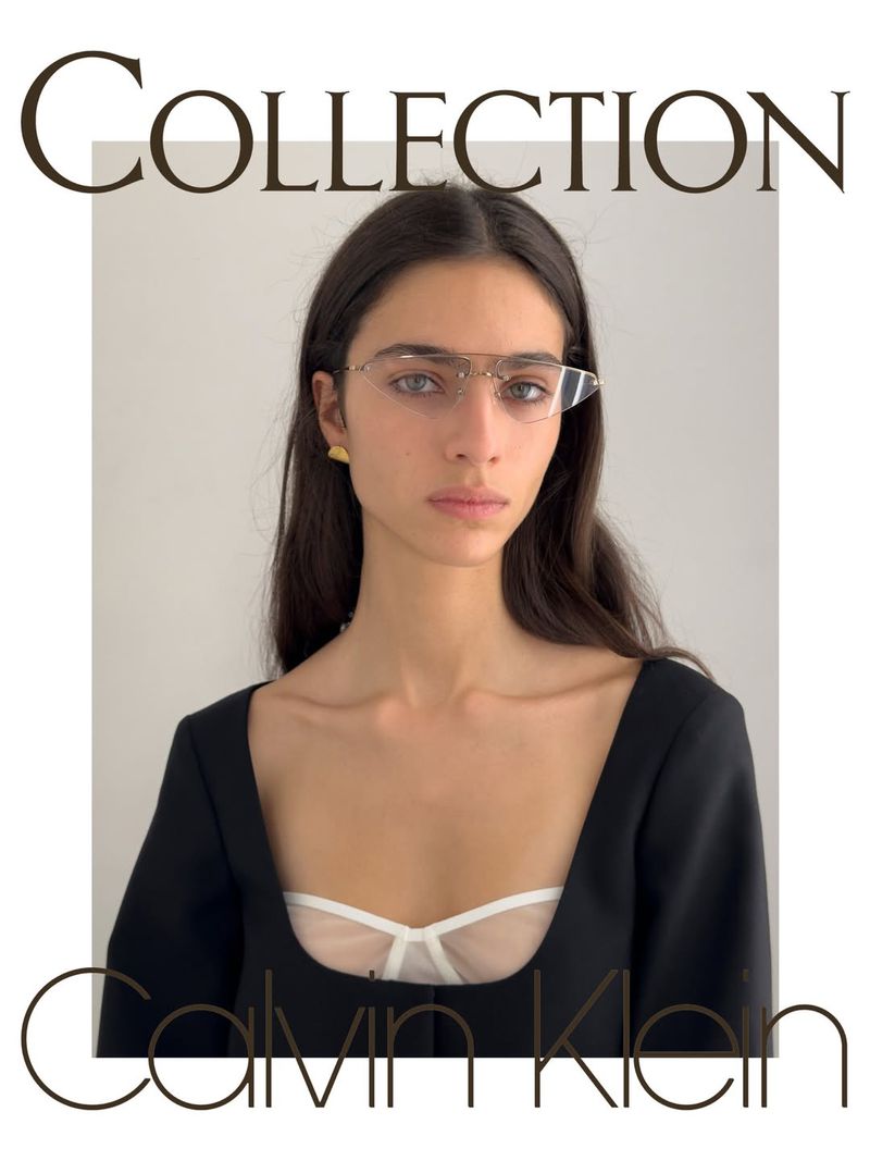 Model Loli Bahia wearing rimless geometric glasses and a black square-neck top for Calvin Klein Collection.