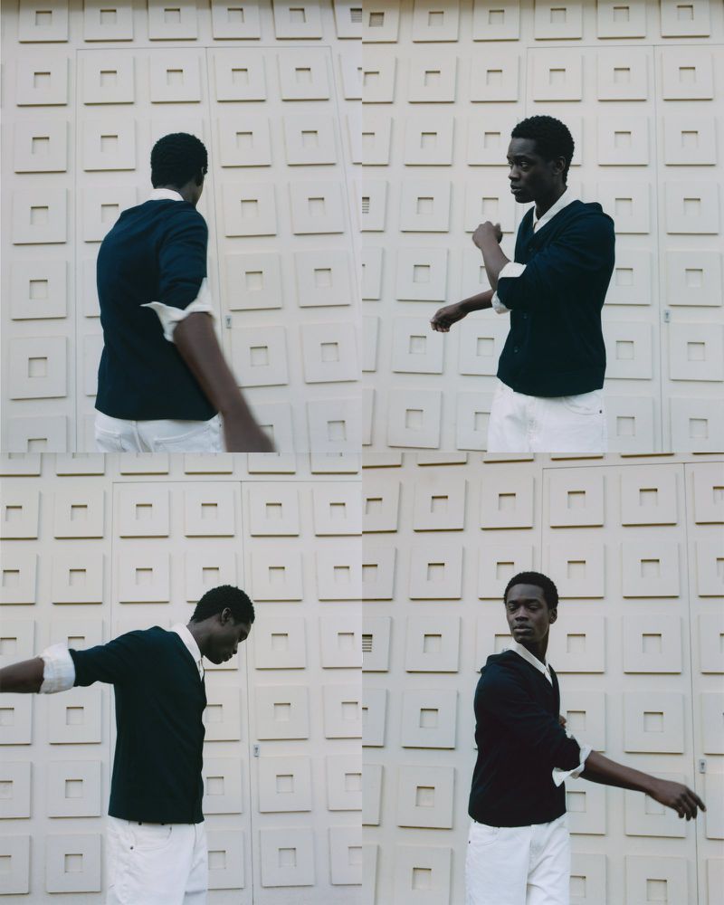 Four captures of a Black man in a dark sweater and white pants against a geometric wall, capturing different arm movements.