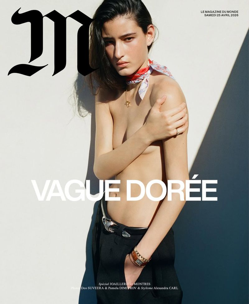 Luiza Perote poses topless wearing a patterned neck scarf, jewelry, and black trousers for M Le magazine du Monde cover.