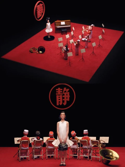 Fashion shot of a woman in a white dress holding a handbag, standing in front of musicians in orange suits against a dark backdrop.