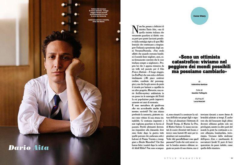 Actor Dario Aita resting his chin on his hand in a white shirt and necktie for a Style Magazine Italy editorial feature spread.