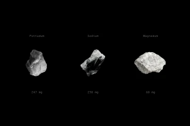 Three mineral specimens labeled Potassium, Sodium, and Magnesium with milligram values centered on a solid black background.