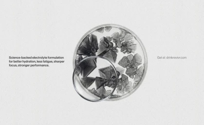 Microscopic view of electrolyte crystals in a circular petri dish with a magnifying lens overlay and minimalist branding text.