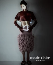 Model So Young Kang wearing a leather crop top, opera gloves, and textured looped skirt for Marie Claire Korea.