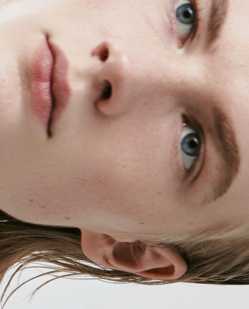 Close-up portrait of model Leander Straub focusing on blue eyes, brows, and facial features for Esquire Singapore.