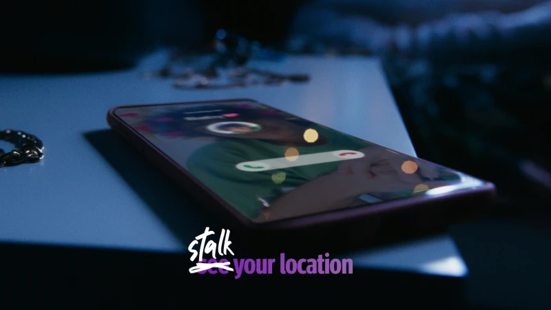 Illuminated smartphone resting on a nightstand with a blurred background, displaying a call screen with incoming call interface.