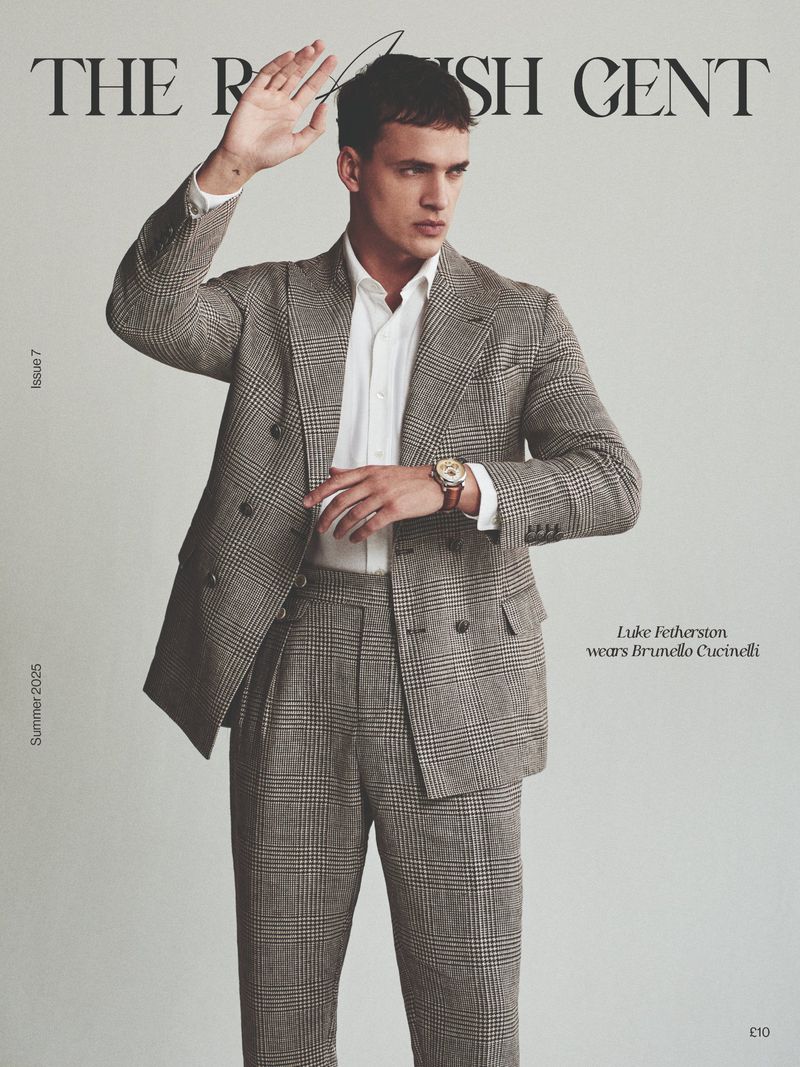 Male model poses in a grey plaid suit on a magazine cover. The British Gent masthead and Luke Featherston text is visible.