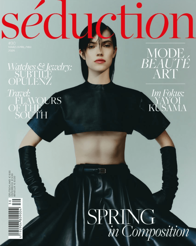 Model Caro Casay in a black leather crop top, full skirt, and long gloves on the Séduction Magazine cover.
