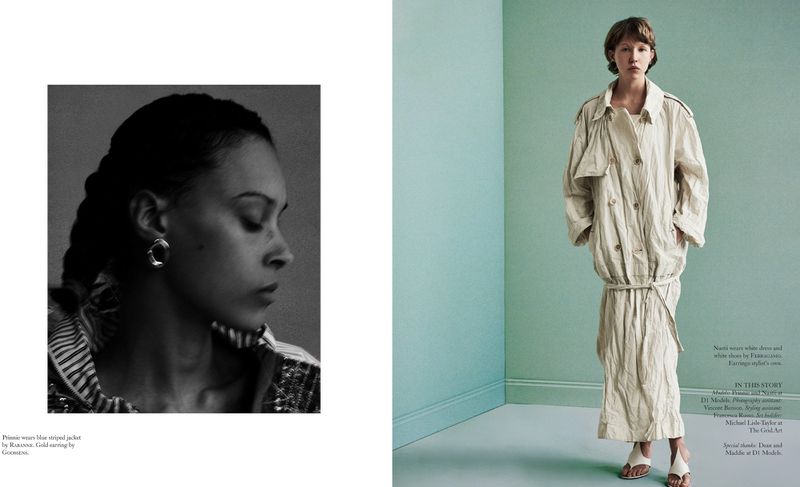Editorial fashion shot with two women: One in black and white, the other in color, wearing a trench coat in an indoor setting.