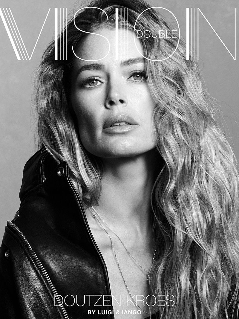 Black and white portrait of model Doutzen Kroes wearing a black leather jacket with long wavy hair for Double Vision cover.