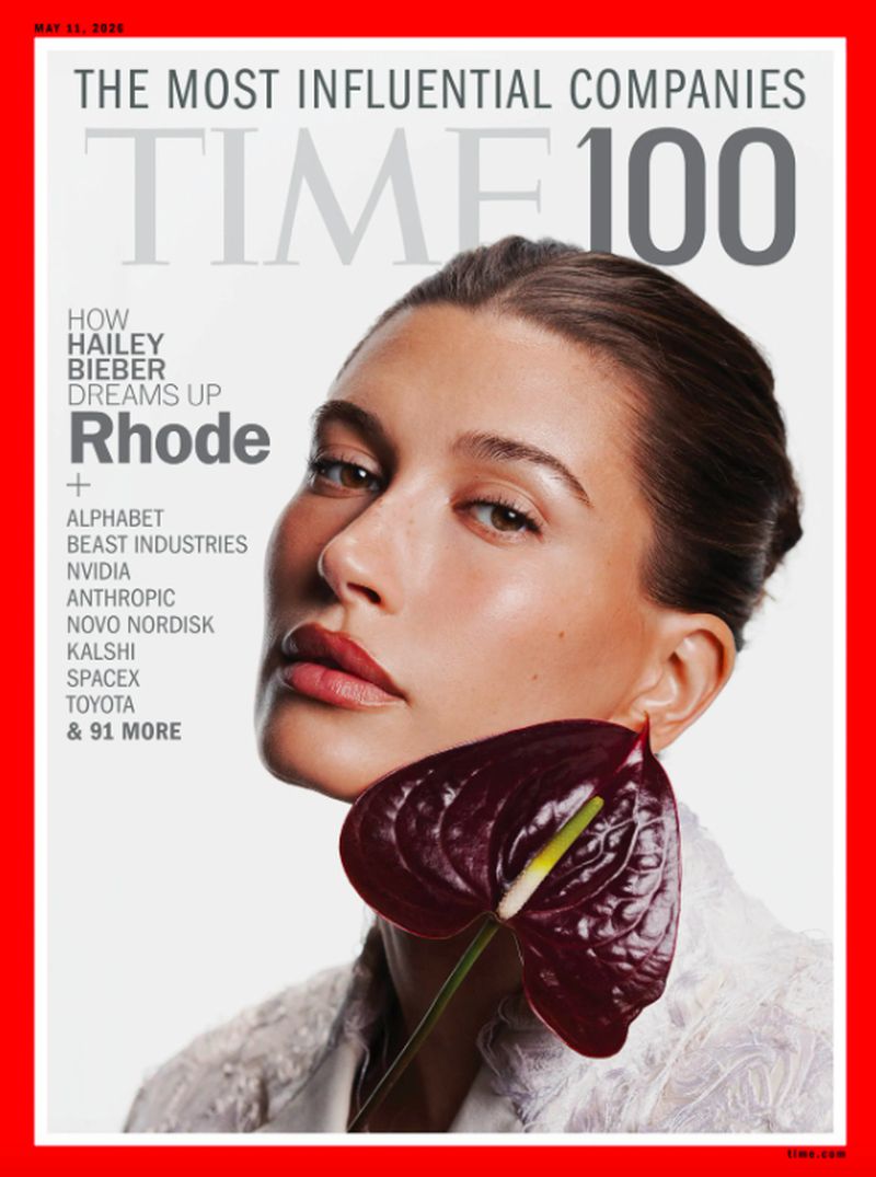 Time 100 cover featuring Hailey Bieber with a close-up headshot, a dark red anthurium flower, and the magazine's title and list of companies.