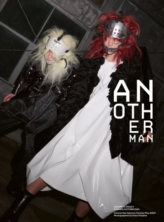 Two models wearing metallic headgear and avant-garde clothing in an editorial magazine layout for AnOther Man Magazine.
