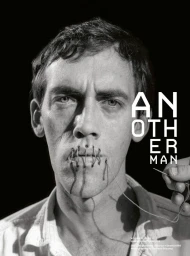 Portrait of a man with lips stitched shut by a needle and thread against a black background for AnOther Man Magazine.