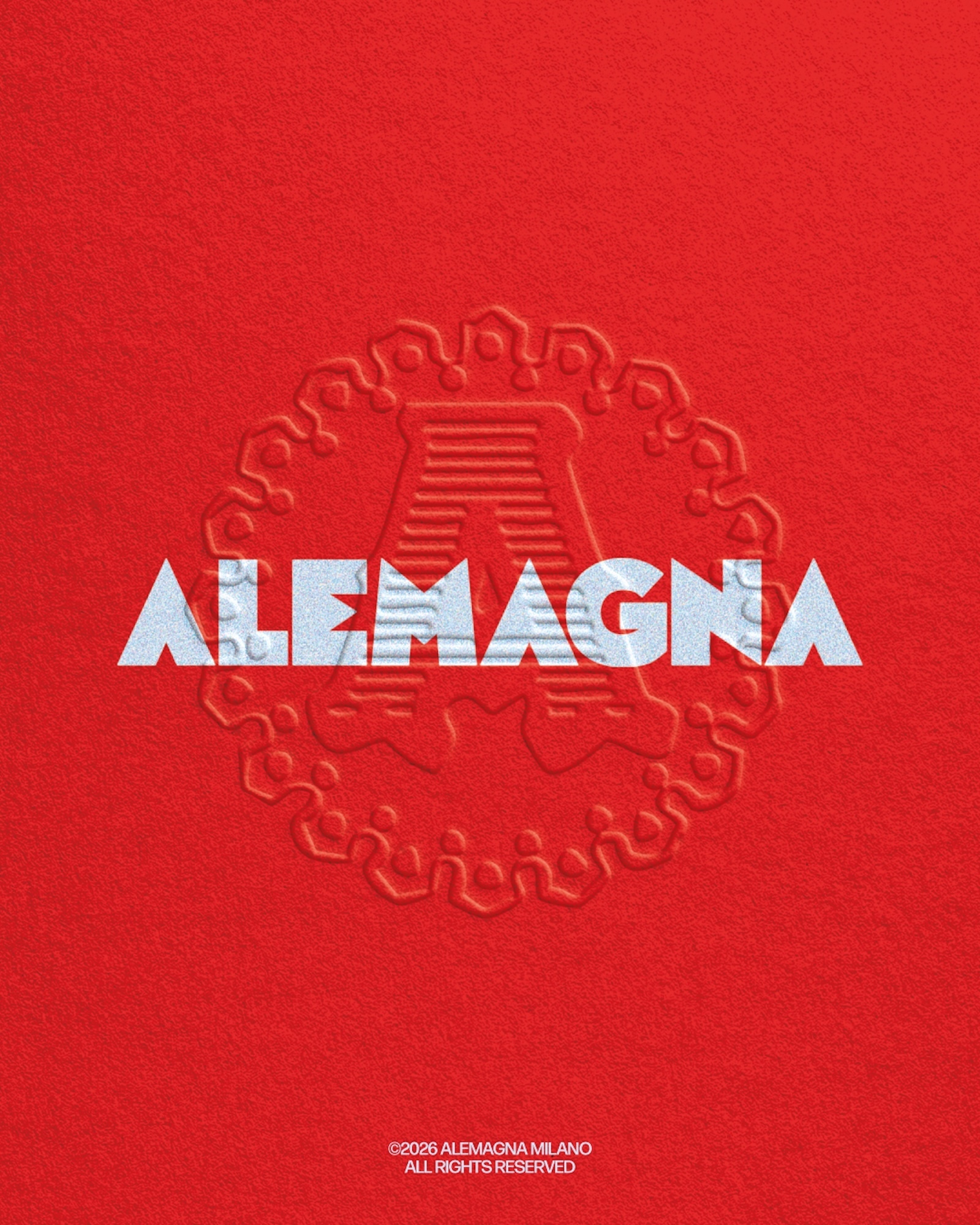 Embossed circular logo on textured red paper with white typography reading Alemagna for a brand identity project.