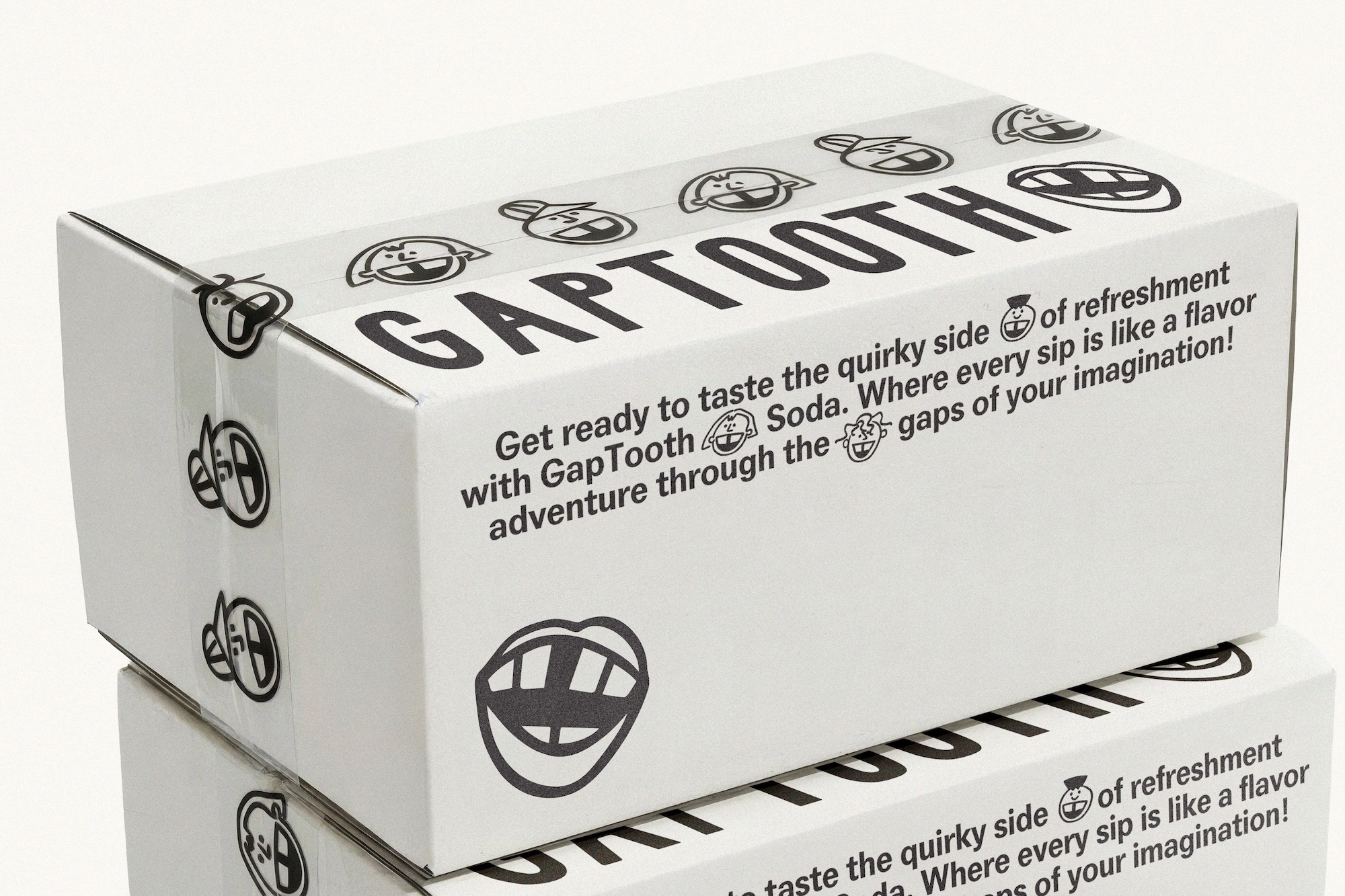 White cardboard box branded with GAPTOOTH text, graphic mouth illustrations, and promotional text on a white seamless background