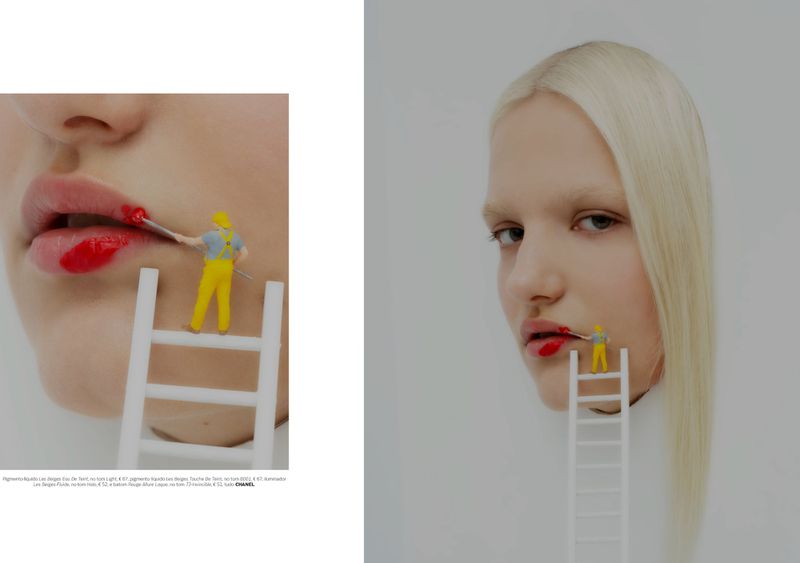Model with blonde hair and a miniature figure on a white ladder painting her lips with red lipstick for Vogue Portugal