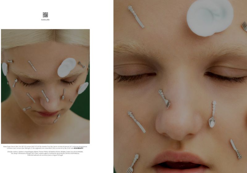 Close-up portrait of a blonde model with miniature cutlery and white plates adhered to her face for a Vogue Portugal editorial
