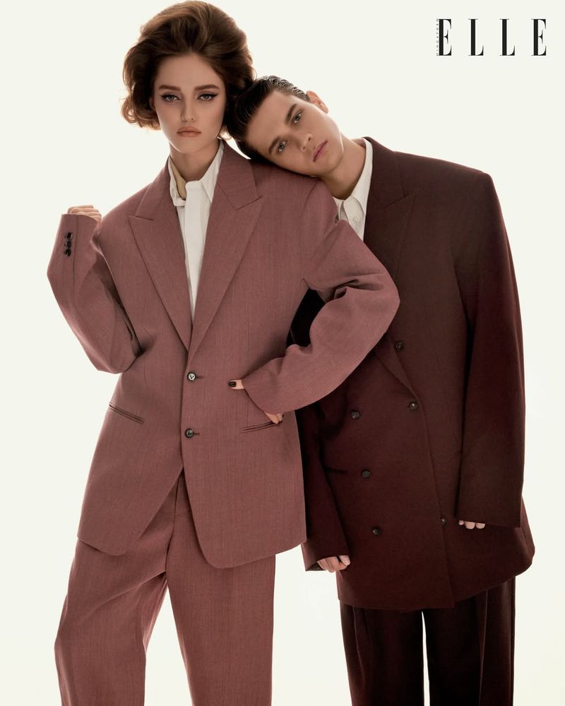 Two models in oversized tailored suits against a plain white background, photographed by Stefan Khoo for Elle Singapore.