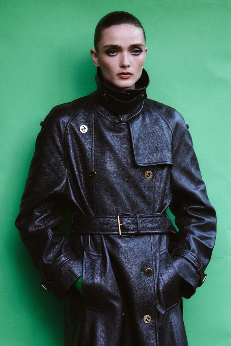 Model Gertrud Rose in a black leather belted coat against a green backdrop for Re-Edition Magazine by Phil Engelhardt