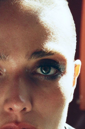 Close-up portrait of model Gertrud Rose featuring strong side lighting highlighting facial features