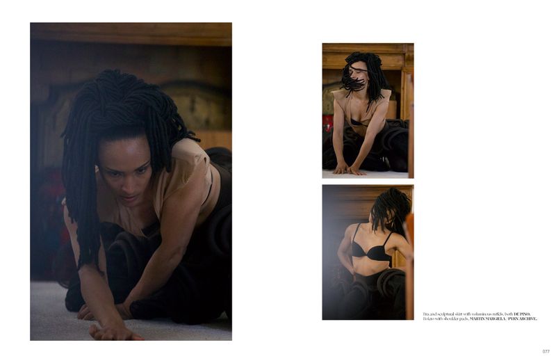 Woman with long dreadlocks and neutral clothing poses crouching on a carpet, viewed in full light with two additional small images.