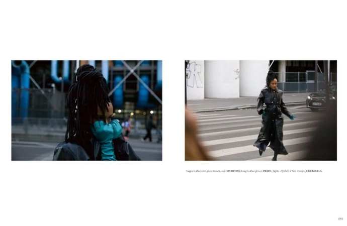 Model wearing a black leather coat and vibrant blue gloves walking near a crosswalk for Dry Clean Only Magazine editorial