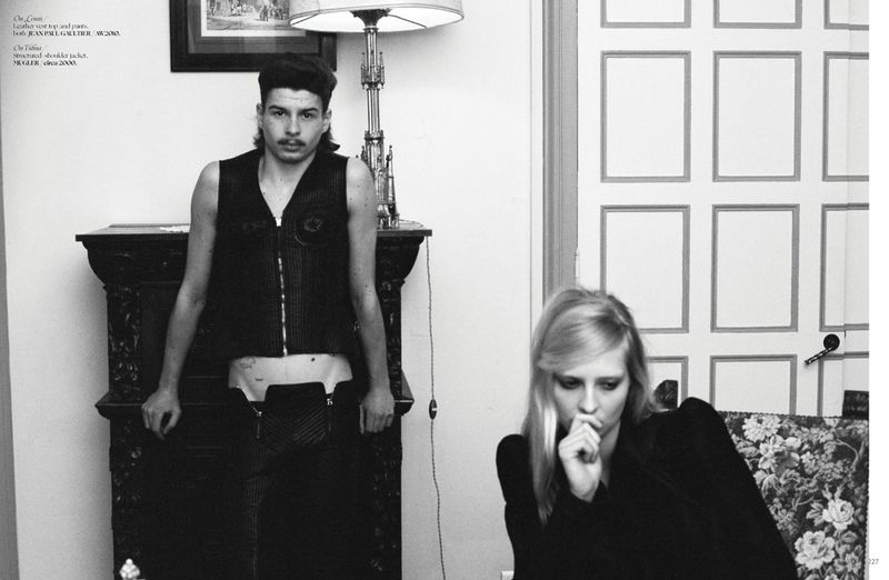 Black and white portrait of a man standing and a woman seated indoors for Dry Clean Only Magazine