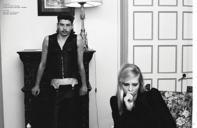 Black and white portrait of a man standing and a woman seated indoors for Dry Clean Only Magazine