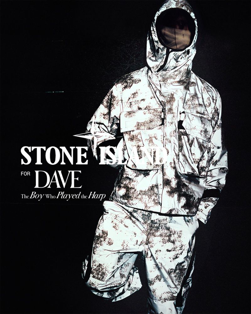 Model wearing a reflective camo jacket and trousers against a dark background in the Stone Island for Dave campaign.