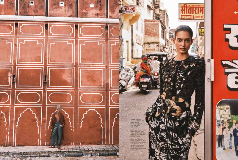 Model wearing patterned black top and trousers with heavy belt standing on a busy street for Harper's Bazaar Arabia