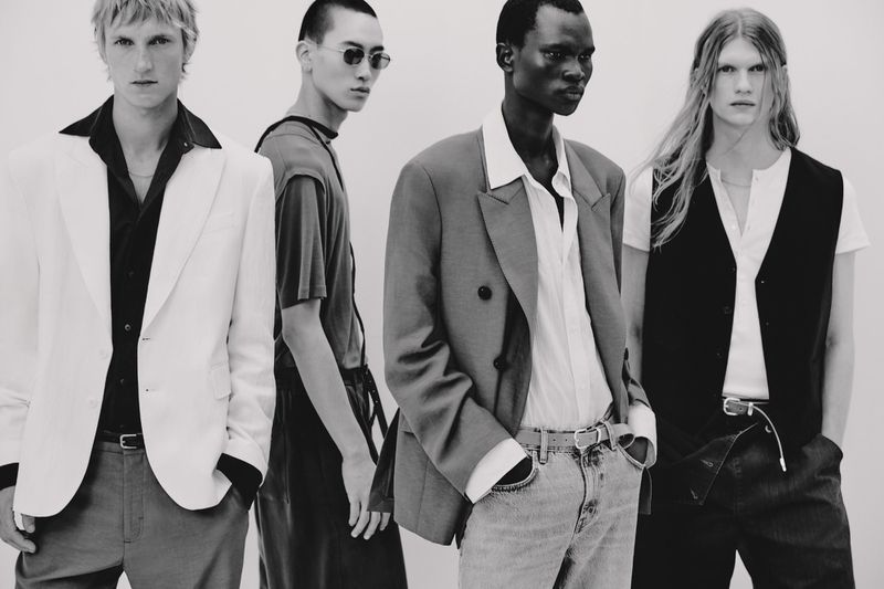 Four male models in contemporary menswear posing against a light background for Zara Man