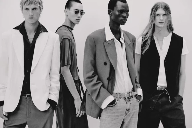 Four male models in contemporary menswear posing against a light background for Zara Man