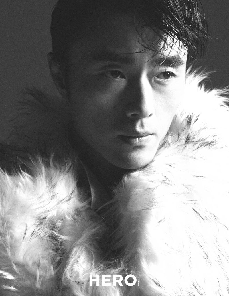 Close-up portrait of model Zhao Lei wearing a textured faux fur coat in a dramatic monochrome editorial for Hero China.