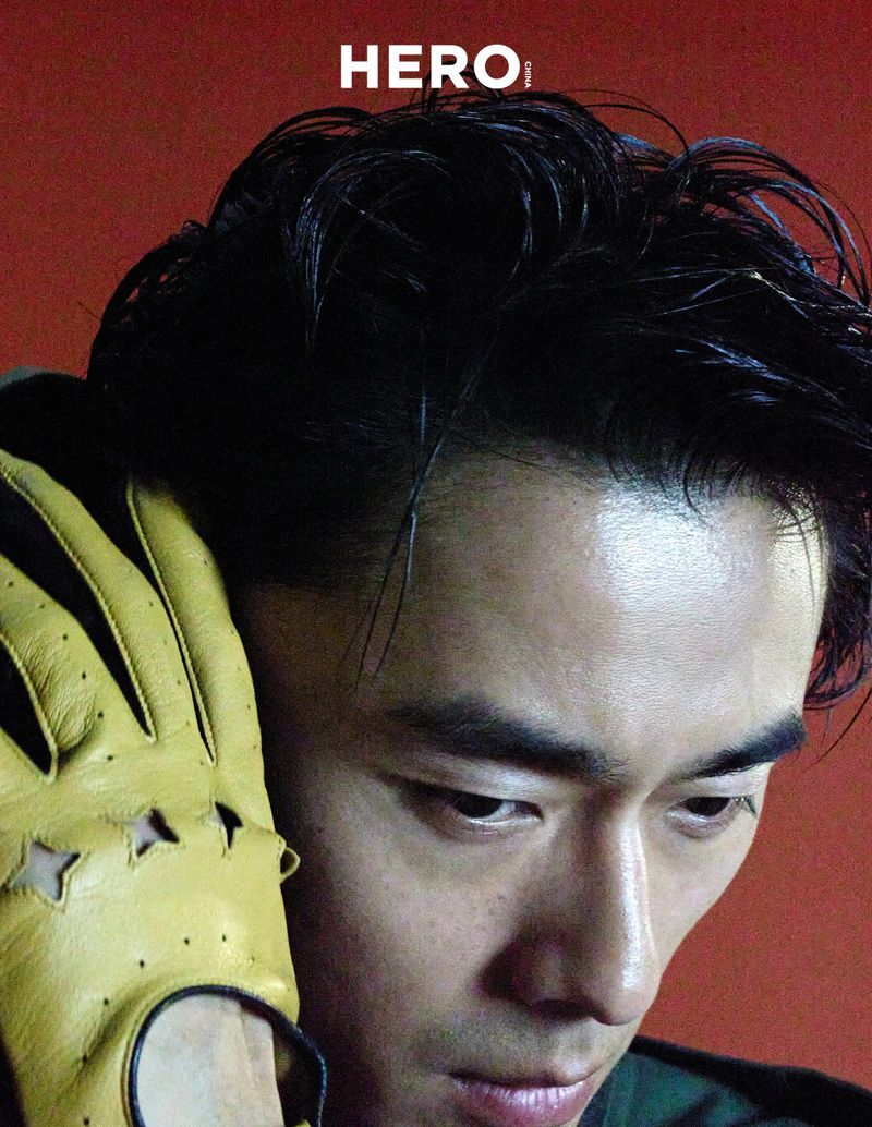 Close-up portrait of model Zhao Lei wearing yellow leather driving gloves for Hero China editorial photographed by Shenyun Ren