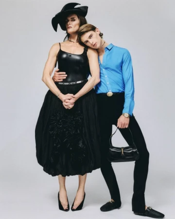 Brooke Shields and male model posing together against a plain grey studio backdrop for an editorial fashion shoot by Cody Lidtke.