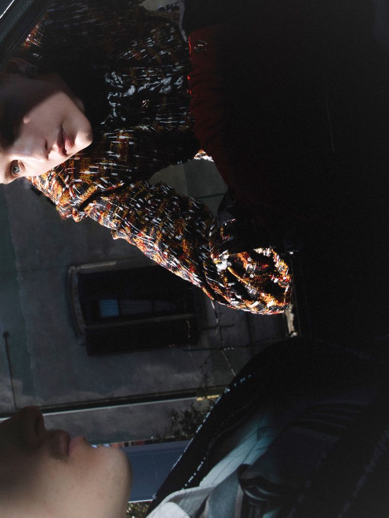 Two models posing in a reflective car window setting for ODDA Magazine editorial ODDA Magazine