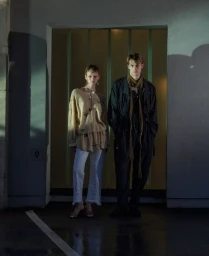 Two models posing in a doorway with a light background for ODDA Magazine shot by Mark Yareham