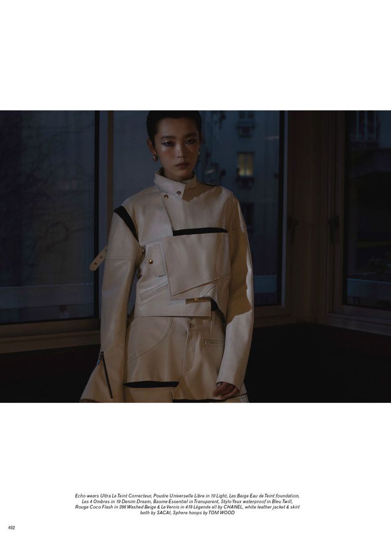 Model Echo Zhao in white leather jacket standing indoors against windows for Pop Magazine project Echo / Fresh!