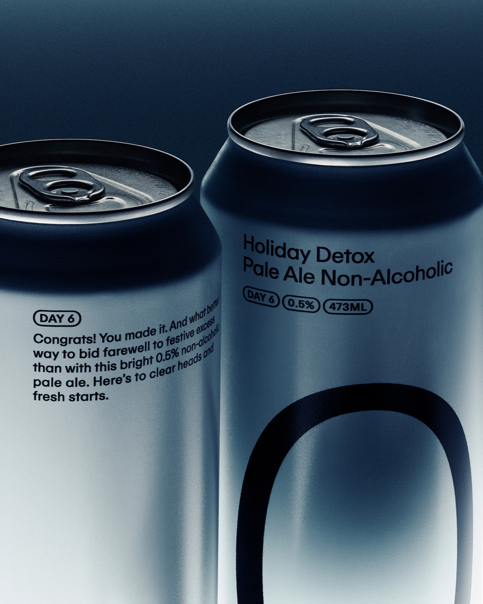 Two aluminium beverage cans with dark typography against a dark studio background under moody lighting.
