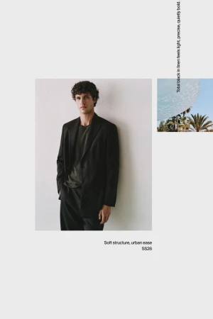 Model Francisco Henriques in a black blazer and trousers against a white seamless background for Massimo Dutti