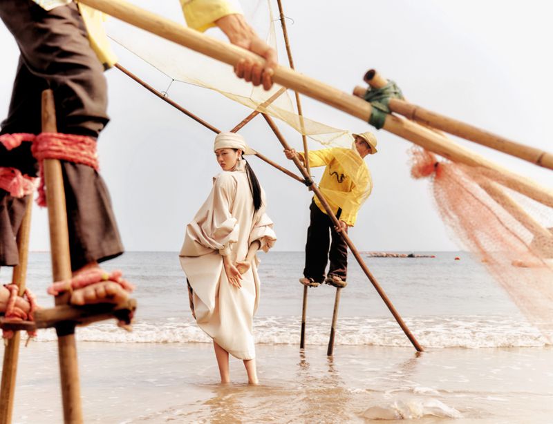 Models on stilts and beach setting for Glass Magazine China editorial project ISLAND shot by Mario Wang