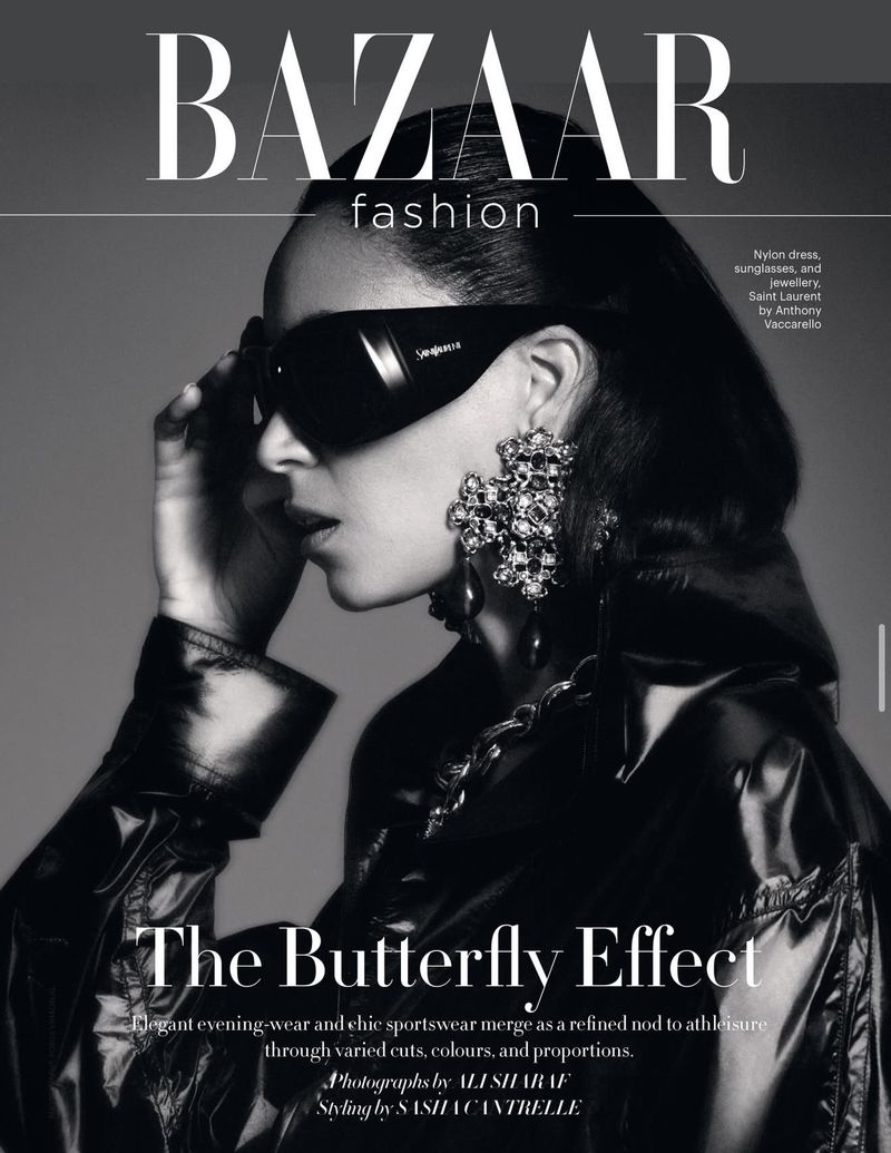 Model in profile wearing dark sunglasses and ornate jeweled earrings against a grey backdrop for Harper's Bazaar India