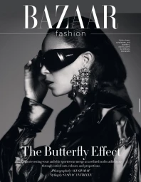 Model in profile wearing dark sunglasses and ornate jeweled earrings against a grey backdrop for Harper's Bazaar India