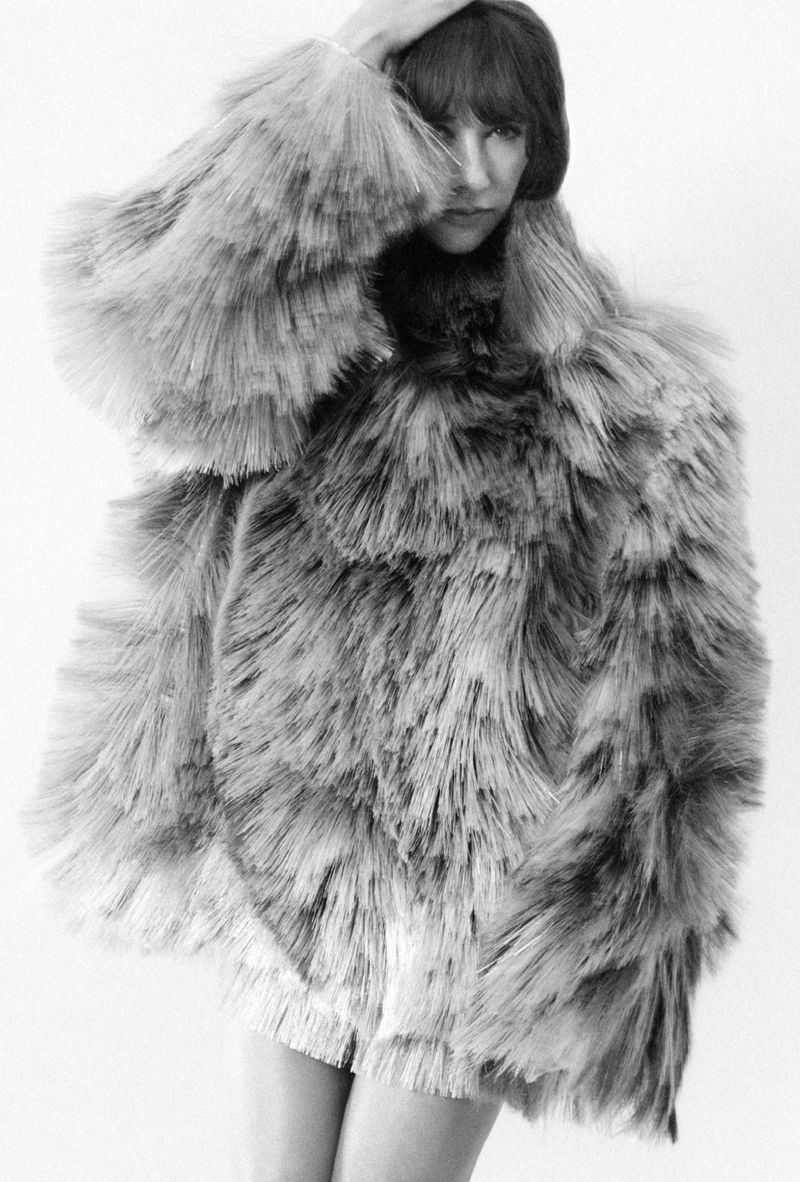 Rashida Jones wearing a textured shaggy coat in a black and white editorial portrait for MARFA Good Friends.