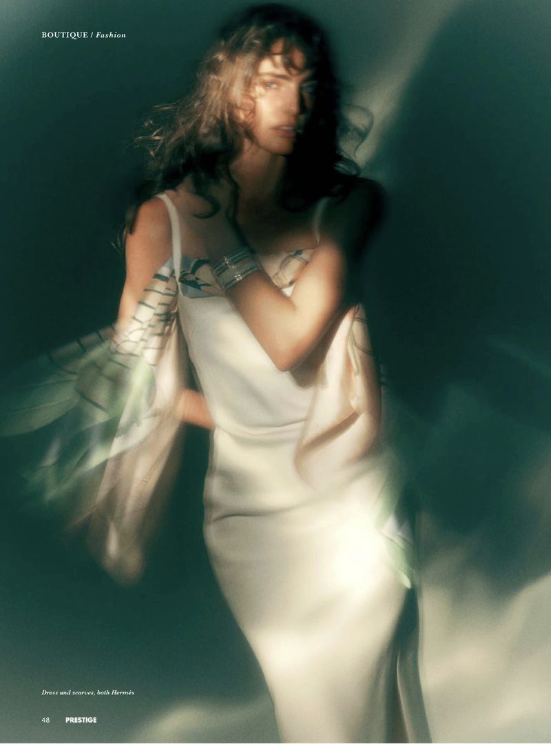 Model Marinet Matthee wearing a white dress in a blurry editorial portrait for Prestige Magazine Asia shot by Joel Low.