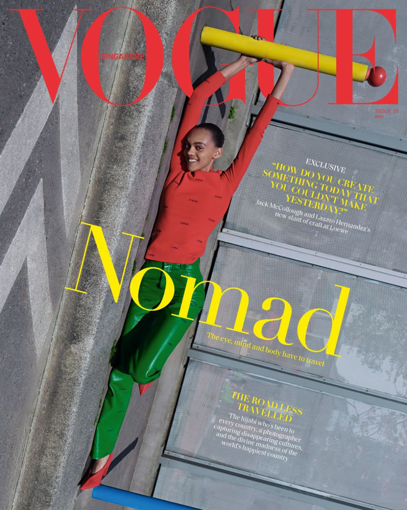 Vogue Singapore cover featuring a woman in red shirt and green pants holding yellow bar, angled aerial view against concrete backdrop.