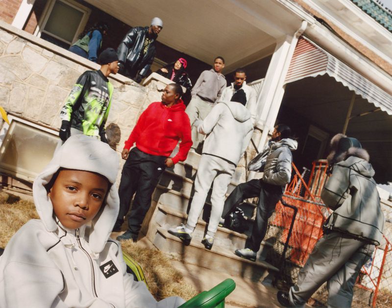 Group of young people posing outside a residential house on a sunny day for Nike, photographed by Bolade Banjo.