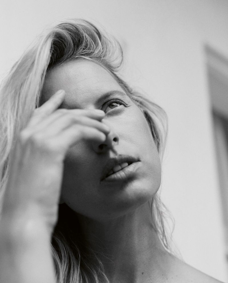 Close-up portrait of model Karolina Kurkova touching her face for Vogue Czechoslovakia May 2026 Covers